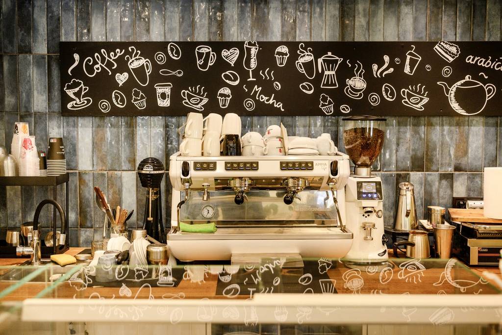 Coffee bar with espresso machine and chalkboard art